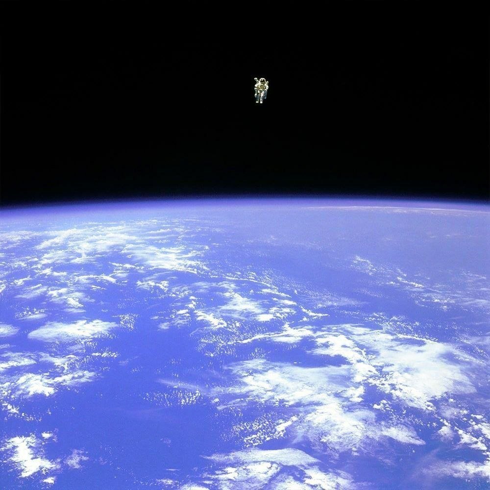 Real photo of astronaut Bruce McCandless in open space.

He drifted nearly 100 meters away from the Challenger spacecraft - farther than anyone before him.