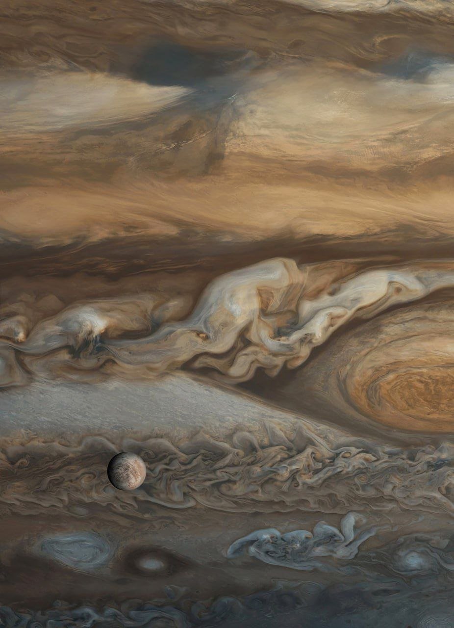 Europe is a moon of Jupiter with an icy surface and a hidden ocean beneath. Scientists believe that this ocean could potentially harbor life due to its similarities to Earth's oceans. The moon's surface is marked by long cracks and ridges, caused by the gravitational pull of Jupiter, which generates immense tidal forces on Europe. These forces create heat within the moon, maintaining its subsurface ocean in liquid form.