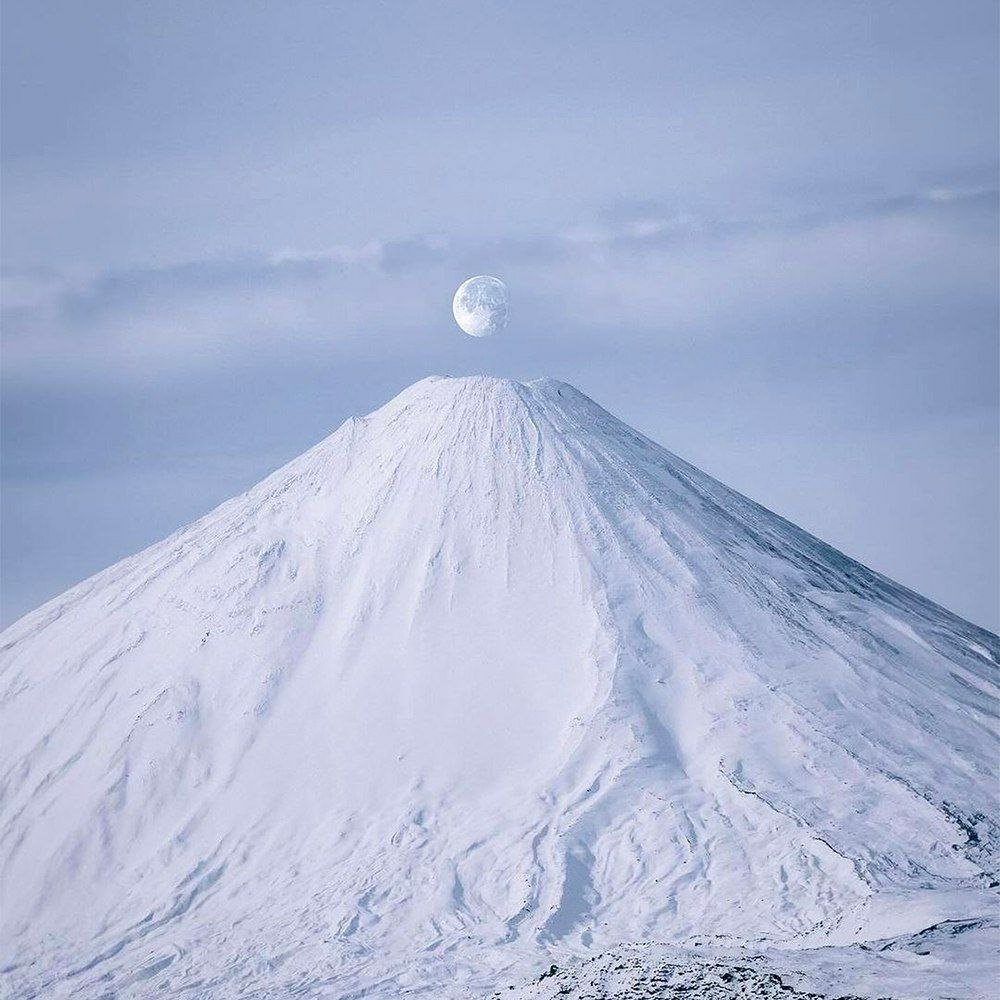 Volcano Antuco under the Full Moon

Under the enchanting glow of the full moon, the majestic Volcano Antuco stands tall, creating a breathtaking and mesmerizing sight. The moonlight illuminates the snow-capped peak, casting a surreal and mystical ambiance over the landscape.

The serene and peaceful atmosphere under the full moon enhances the beauty of the volcano, making it a truly awe-inspiring natural wonder. Visitors and locals alike are captivated by this stunning display of nature's grandeur, creating a moment of pure tranquility and reflection in the presence of such magnificence.