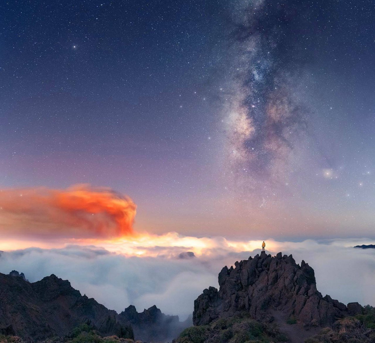 Milky Way and Volcano Eruption Captured in Stunning Photo

Astrophotographer Javier Martinez recently captured a breathtaking image showcasing the Milky Way alongside a volcano eruption on the left. The photo was taken in the picturesque location of the Canary Islands.

This striking photograph beautifully combines the celestial beauty of the Milky Way with the raw power and energy of a volcanic eruption, creating a mesmerizing contrast in the night sky. Martinez's skillful composition highlights the coexistence of natural wonders on Earth and in the universe above.