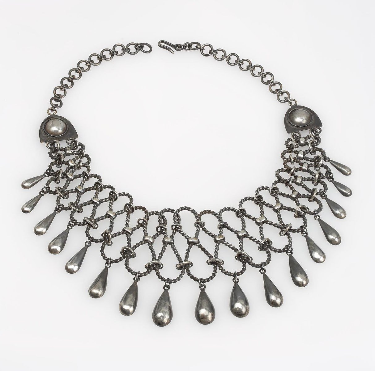 Necklace "Byliny" by Taisia Fedorovna Chistyakova Showcased at Moscow Kremlin Museums

The stunning necklace named "Byliny" was created by artist Taisia Fedorovna Chistyakova in the USSR, now Russian Federation, between 1962-1963. Crafted from silver, the piece underwent processes like scanning, oxidation, and mounting. The necklace measures 26.5 cm in length when closed, showcasing intricate craftsmanship and design.

This exquisite piece is currently on display at the Moscow Kremlin Museums, where visitors can admire the artistry and detail of Chistyakova's work. The "Byliny" necklace stands as a testament to the artist's skill and creativity, offering a glimpse into the cultural and artistic heritage of the region.